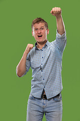 Image showing Winning success man happy ecstatic celebrating being a winner. Dynamic energetic image of male model