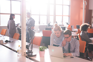 Image showing Two Business People Working With laptop in office