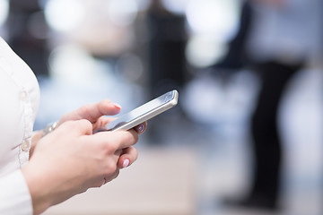 Image showing Elegant Woman Using Mobile Phone in startup office building