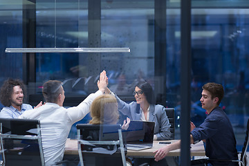 Image showing startup Group of young business people celebrating success