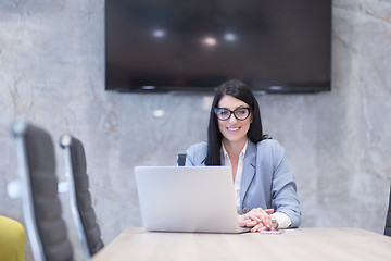 Image showing businesswoman using a laptop in startup office