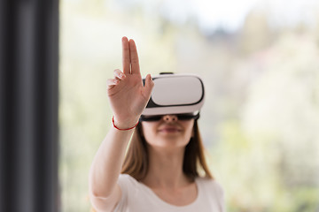 Image showing woman using VR-headset glasses of virtual reality