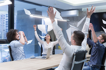 Image showing startup Group of young business people throwing documents