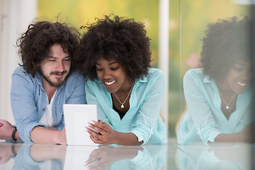 Image showing Couple relaxing together at home with tablet computer