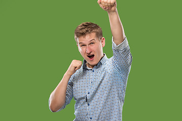 Image showing Winning success man happy ecstatic celebrating being a winner. Dynamic energetic image of male model