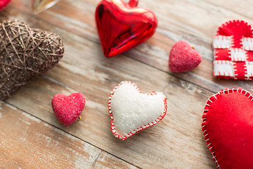 Image showing heart shaped decorations on wooden background