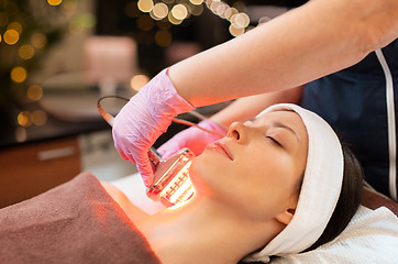 Image showing young woman having face microdermabrasion at spa