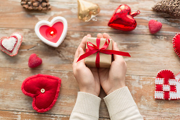 Image showing hands holding christmas or valentines day gift