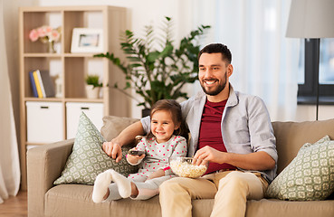 Image showing happy father and daughter watching tv at home