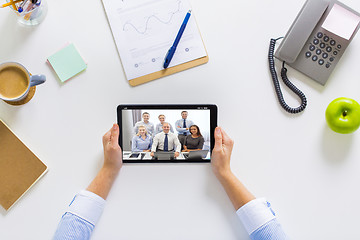 Image showing businesswoman having video conference on tablet