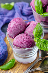 Image showing Blueberry ice cream with basil in glasses.