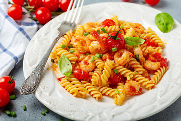 Image showing Pasta with shrimp in tomato sauce close up.