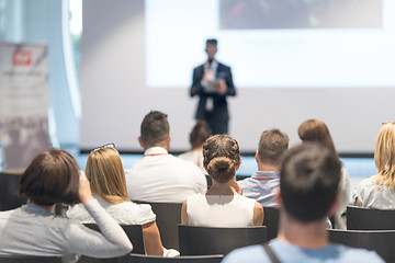 Image showing Male business speaker giving a talk at business conference event.