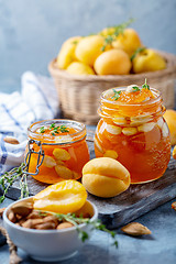 Image showing Homemade apricot jam with thyme and sweet almonds.