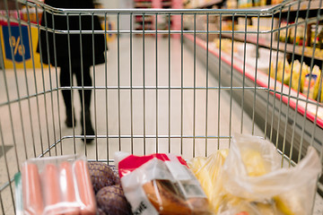 Image showing view from the shopping cart. product in the supermarket trolley.