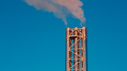 Image showing shiny stainless steel metal pipe smokes