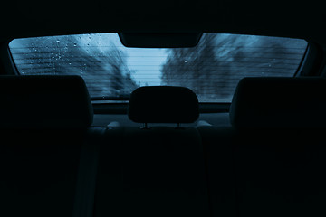 Image showing driving a car in the view the rear window