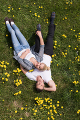 Image showing man and woman lying on the grass