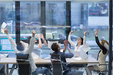 Image showing startup Group of young business people throwing documents