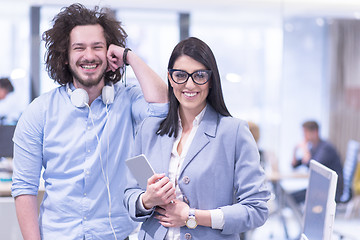 Image showing Business People Working With Tablet in startup office