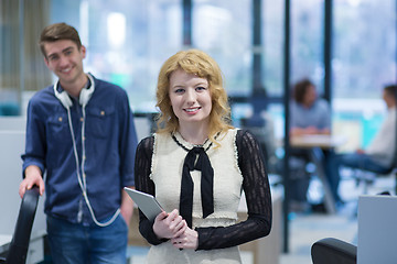 Image showing Business People Working With Tablet in startup office