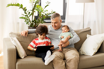 Image showing happy father with preteen and baby son at home