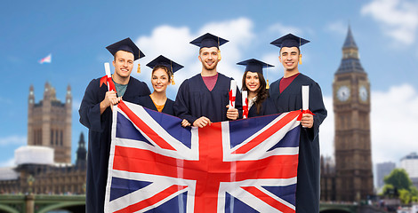 Image showing graduate students with diplomas and british flag