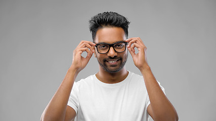 Image showing happy indian man in eyeglasses or student