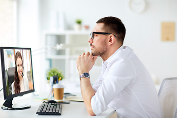 Image showing businessman having video call on office computer