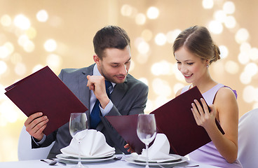 Image showing couple with menus at restaurant