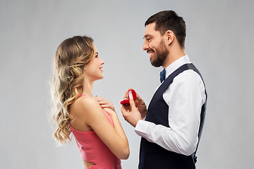 Image showing man giving woman engagement ring on valentines day