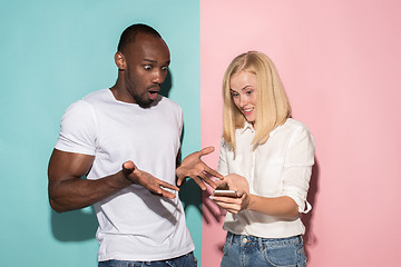 Image showing Portrait of a confident casual girl with mobile phone and afro man