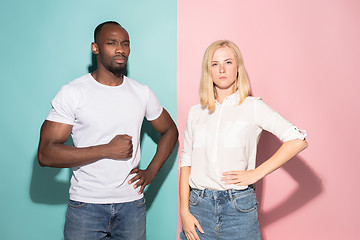 Image showing Young serious thoughtful businessman and woman. Doubt concept.