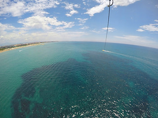 Image showing Speedboat dragging  parachute