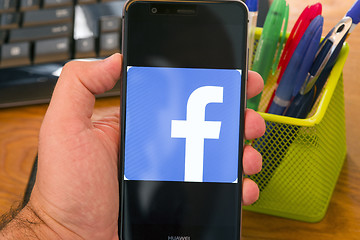 Image showing Facebook logo on the screen