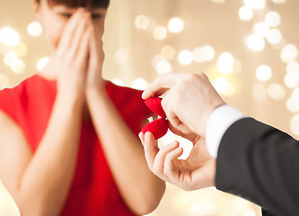 Image showing man giving diamond ring to woman on valentines day