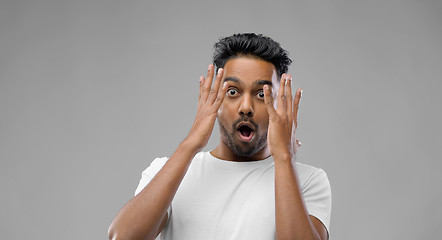 Image showing shocked indian man over grey background