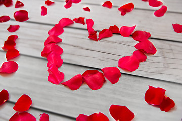 Image showing close up of red rose petals in heart shape