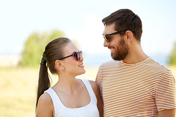 Image showing happy couple in sunglasses outdoors in summer