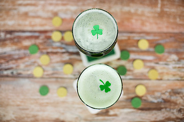 Image showing glasses of green beer with shamrock from top