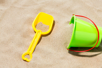 Image showing close up of toy bucket and shovel on beach sand