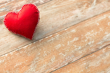 Image showing red heart shaped decoration on wooden background