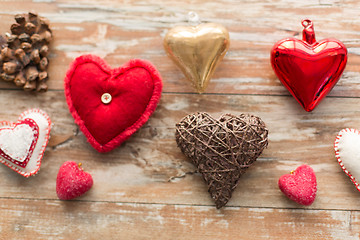 Image showing heart shaped decorations on wooden background
