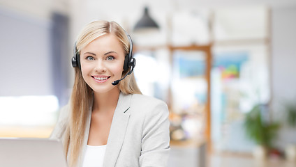 Image showing helpline operator in headset working at office