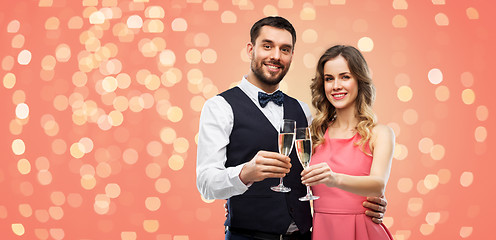 Image showing happy couple with champagne glasses toasting