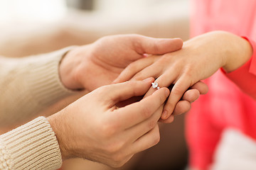 Image showing man giving diamond ring to woman on valentines day