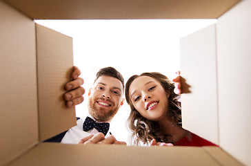 Image showing happy couple opening christmas gift box