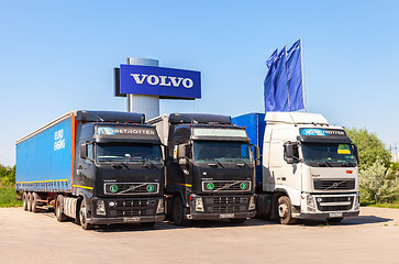 Image showing Volvo trucks parked at the service station in summer day