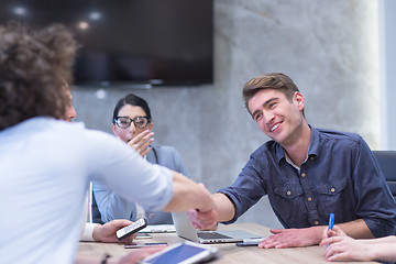 Image showing cloasing the deal in modern office interior