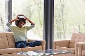 Image showing black woman using VR headset glasses of virtual reality